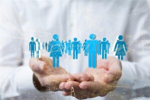 A person in a white shirt holding digital icons of people