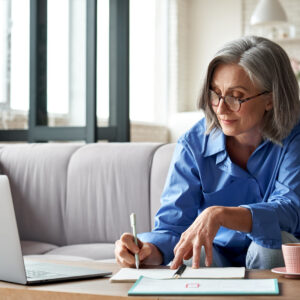 Happy Stylish Mature Old Woman Remote Working from Home